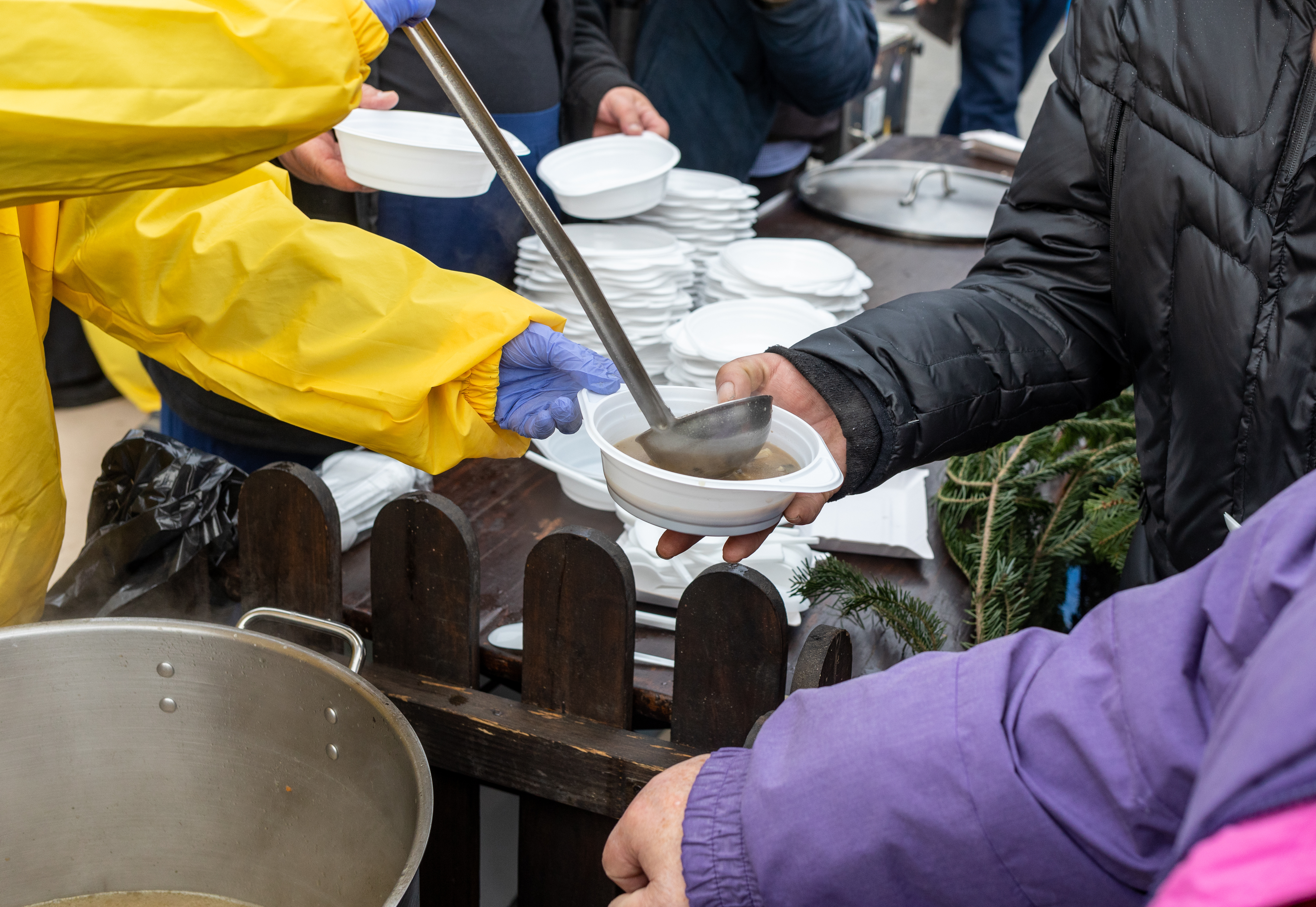 Volunteers serving hot meals at the In Touch mobile kitchen
